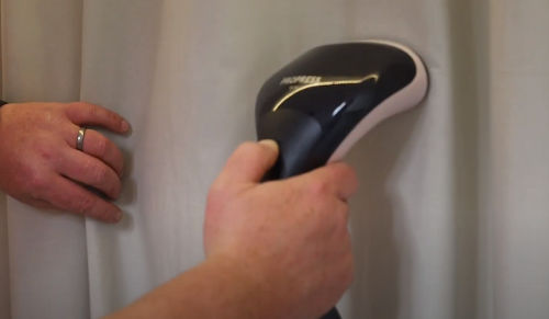 use clothes steamer to remove wrinkles from polyester curtains