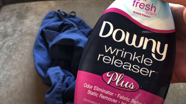 using wrinkles releaser spray to remove wrinkles from your jeans